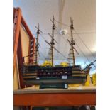 A model of 18th century Warship having cross section side showing Canons, 3 masted