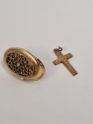 9ct yellow gold cross pendant marked 375, and unmarked yellow metal oval locket with decorative pane