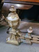 A decorative gilt metal fender decorated urns and a brass tan fire screen