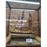 A small handmade model of galleon in glazed case