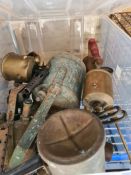 A selection of vintage blow torches and animal cage