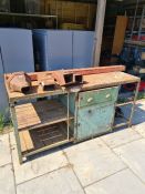 A vintage large wood and metal Industrial work bench