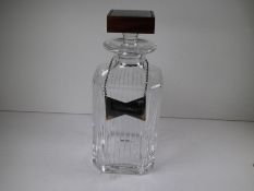 A David Linley Trafalgar Square decanter having a handblown crystal and walnut stopper inlaid with a