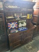 A reproduction oak dresser with rack back