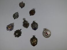 A quantity of silver medals, some having gold details and enamel, various hallmarks and dates for di