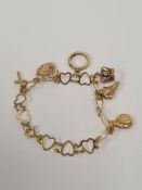 9ct yellow gold charm bracelet comprising of heart shaped links, hung 6 charms, one unmarked, 6 9ct