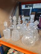A selection of cut glass decanters, one being in the form of Thistle