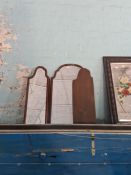 A decorative wall mirror painted flowers and two others