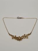 Victorian 15ct and seed pearl floral design necklace constructed central flowerhead panel with scrol