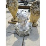 A pair of lions and a female bust