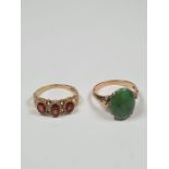 A 9ct yellow gold dress ring set with 3 oval faceted garnets, in decorative mount and heart shaped s