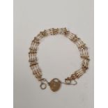 9ct yellow gold 4 bar gatelink bracelet with heart shaped clasp and safety chain, marked 375, approx