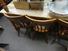 A modern pine oblong kitchen table on turned legs with 6 kitchen chairs