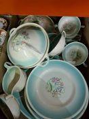 A tray of Susie Cooper dinner ware having green border with floral centre