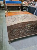 An Oriental carved camphor wood blanket box decorated flowers and leaves