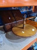 An old mahogany sloping stationary cabinet and mahogany revolving cake stand
