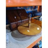 An old mahogany sloping stationary cabinet and mahogany revolving cake stand