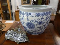 A reproduction Chinese style fish bowl and an inkwell