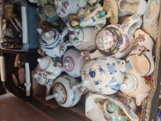 A tray of miniature teapots and sundry