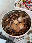 A tin of mainly copper coinage and a tub of mainly copper coinage and a tub of military badges and s