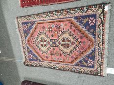 Five small rugs including an Afghan with repeated design and a small Bakora prayer rug