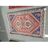 Five small rugs including an Afghan with repeated design and a small Bakora prayer rug