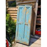 An old painted pine 2 door cupboard probably early 20th Century