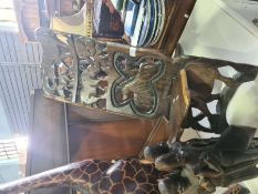 A selection of carved African Art including stool, giraffe and warriors