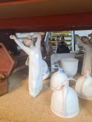 A quantity of Lladro and Nao figurines, Lladro Christmas Bells and similar