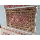 A Belouch style rug having 3 diamond shaped medallions and one other Bokora rug, the largest 161 x 9