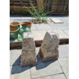 A pair of reconstituted staddle stones bases of square tapering form