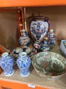 A mixed lot of Chinese and Japanese items to include Imari ginger jars and a pair of blue and white
