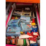 A carton of die cast vehicles, some boxed