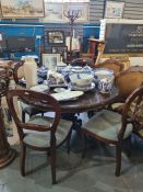 A reproduction circular dining table having inlaid style top and a set of 4 balloon back chairs