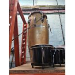 Two pairs of drums and one other larger barrel shaped drum