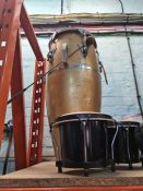 Two pairs of drums and one other larger barrel shaped drum