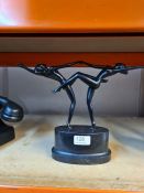 A bronze sculpture of dancing nudes in pose, unsigned