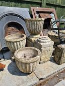 A set of 3 reconstituted garden pots on square bases, two ieth plinths