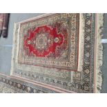 A similar Persian style rug with central spandrel 238 x 170cm and two other smaller rugs, both 183 x