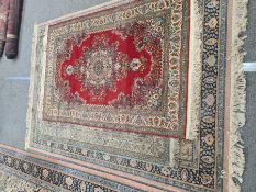 A similar Persian style rug with central spandrel 238 x 170cm and two other smaller rugs, both 183 x