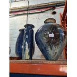Three large pottery vases having blue and cream decorated glaze and one other small dish, signed. Th