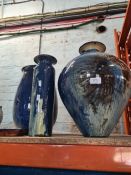 Three large pottery vases having blue and cream decorated glaze and one other small dish, signed. Th