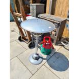 A table top patio heater with gas bottle