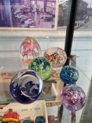 A small quantity of paperweights, two by Medina