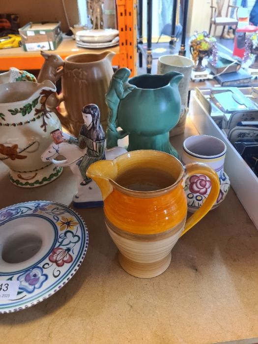 A mixture of Sylvac items, a Clarice Cliff tree design jug and sundry