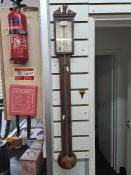An old mahogany stick barometer