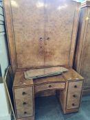 A 1930s walnut dressing table having 7 drawers having 7 drawers and a matching 2 door wardrobe