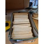 A small box containing vintage postcards, mainly topographical
