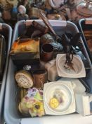 A small tray of powder compacts and two other small trays