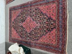 An old Afghan style rug having central diamond shape motif 201cm x 136cm